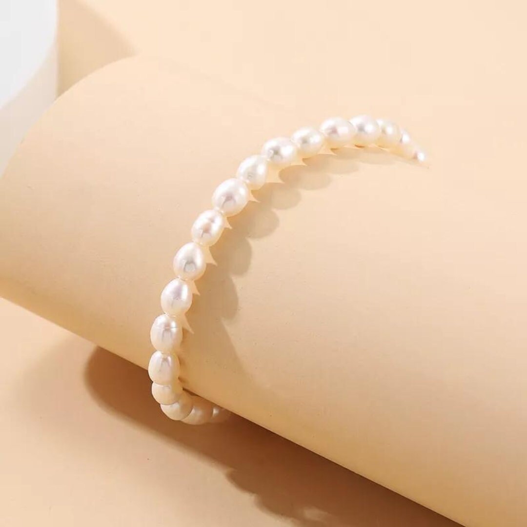 Süßwasserperlen Armband mit Love Anhänger